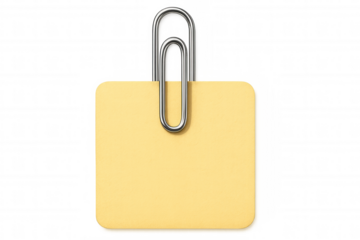 Yellow sticky note fastened by paperclip, hanging against transparent surface, highlighting key details with minimalist design approach