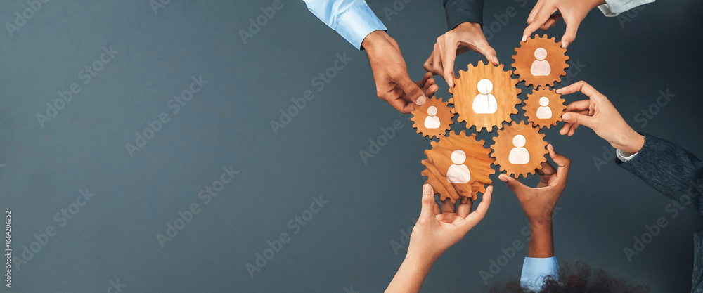 Poster this image showcases hands holding wooden gears with people icons, symbolizing collaboration and net