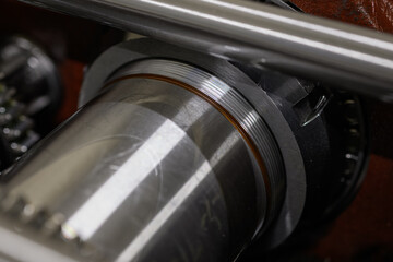 Close-up of a large locking nut securing a bearing inside a machine.
