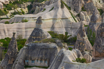 Summer landscape with unusual rock tufa formations of Goreme National Park and the Rock Sites of Cappadocia at Nevsehir Province in Cappadocia, Turkey. Amazing volcanic rock formations