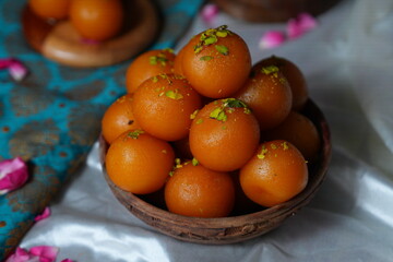 Traditional Indian Sweet Gulab Jamun in Wooden Bowl