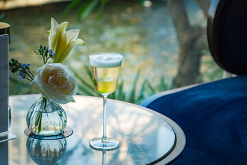 a clear sparkling golden cocktail liquor in Cordial glass serving in evening bar