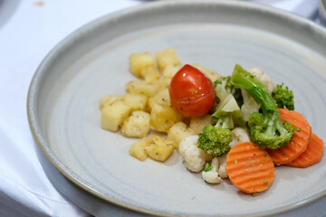 a side dishes appetizer of salad vegetables at dinner reception