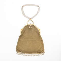 Elegant gold mesh clutch bag with 14-karat yellow gold handle. Photographed isolated on a white background.