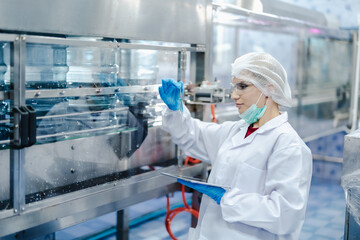 Drinking water factory quality assurance inspector, Quality control team staff working check inspect