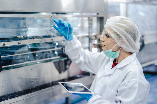 Drinking water factory quality assurance inspector, Quality control team staff working check inspect