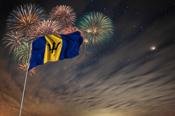 Waving National flag of Barbados and holiday fireworks