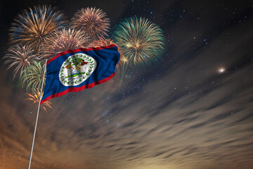 Waving National flag of Belize and holiday fireworks