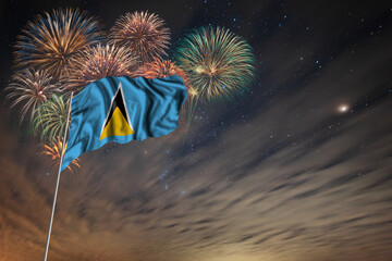 Waving National flag of Saint Lucia and holiday fireworks