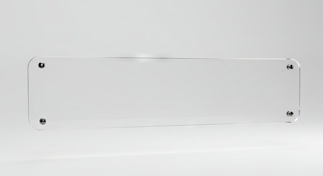 Rectangular clear acrylic sign with rounded corners mounted on wall with metal standoffs