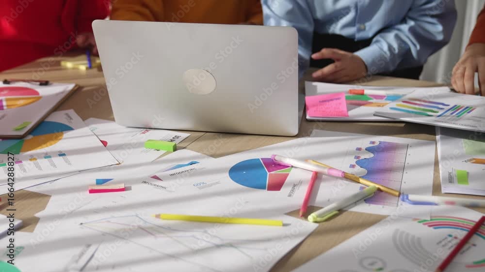 Poster startup company employee working together using laptop analyzing bi dashboard paper on financial dat