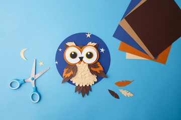 Naklejka na ściany i meble Flat lay of handmade paper owl and supplies for DIY crafts. Ideal for educational publishers, preschool content creators, kids toy packaging, hobby courses promotion