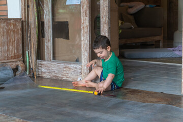Emerson helps Dad on a project