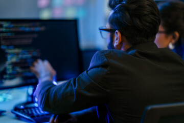 A diverse duo of AI developers in a pair programming session, analyzing a complex algorithm. A concept for teamwork, software engineering, and developing future technologies.