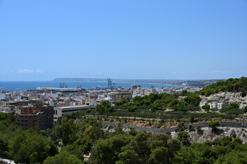 Fototapeta premium View from Castillo de San Fernando of the road leading there and the panorama of Alicante