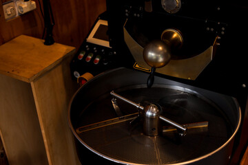 Closeup View of the Cooling Tray of a Professional Coffee Roasting Machine in a Warm Ambiance