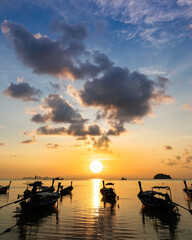 Silhouette, beautiful landscape with sunrise at coast of Andaman sea in summer. Group of...