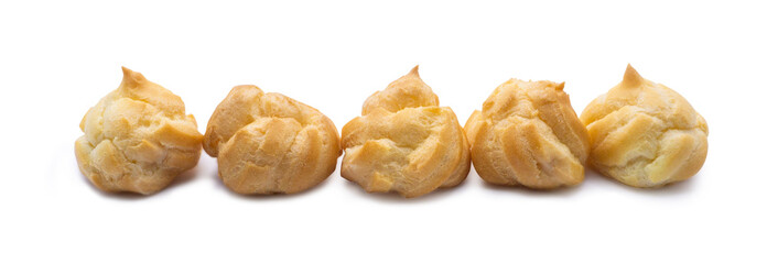 Cream puffs beautifully arranged on a white background.