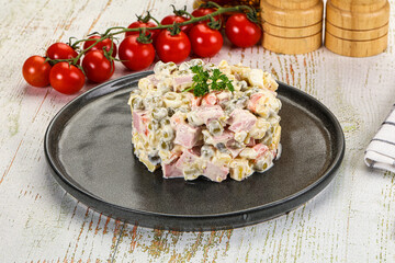 Russian traditional Olivier salad with sausages