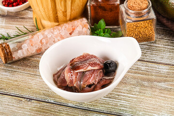 Canned anchovy with oil in the bowl