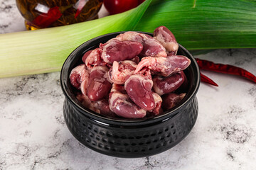 Raw chicken hearts in the bowl