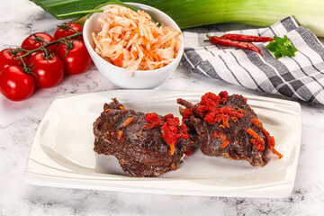 Baked beef cheeks with vegetables