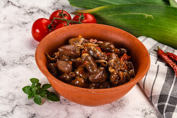 Baked chicken hearts with vegetables