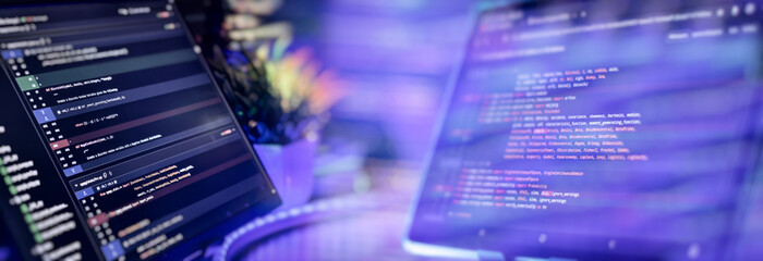 Python programming on dual monitors in tech workspace
