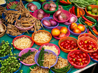 Fresh Vegetables and Herbs on Display at Asian Market Stall.
