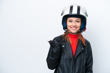 Young Russian girl with a motorcycle helmet isolated on white background pointing to the side to present a product