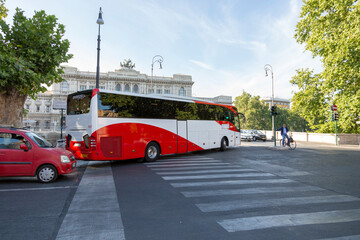 Fototapeta premium Rome, Italy - August 16, 2019: Large tourist bus on a street in the center of Rome
