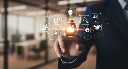 A man in a suit touching a digital interface with various business related icons floating around his finger