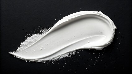 Luxurious white cream texture stroke on black background evokes elegance, freshness, and skincare beauty, perfect for cosmetic branding