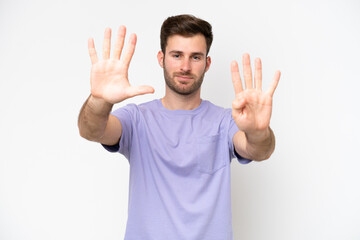 Naklejka premium Young caucasian man isolated on white background counting nine with fingers