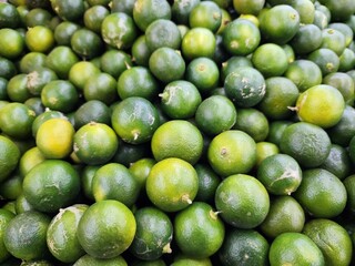 Fresh Green Limes in Abundance at a Market Display