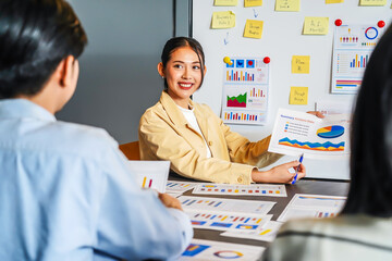 Asian businesswoman startup presenting data chart project management meeting with colleagues,...