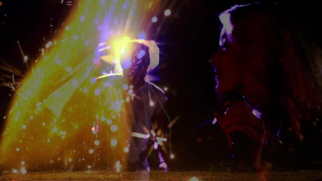 Flame column erupting with sparks behind singer lifting mic and singing during music performance