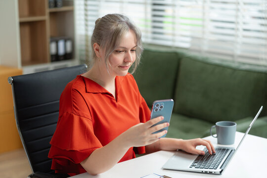 Email notification concept, Female use smartphone and laptop receive message alert in the mailbox.