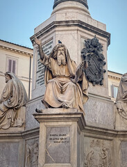Obraz premium ROME, ITALY, Close-up of Moses marble statue at the base of the Column of the Immaculate Conception in Roma. The figure of seated prophet with a long beard and flowing robes