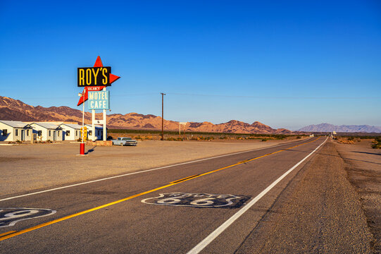 Amboy, California, USA - November 04, 2023 : Route 66 highway sign on the road near Roys vintage motel, cafe, and gas station in Amboy, California.