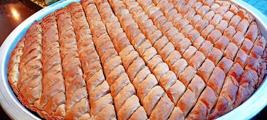 Enjoy mouthwatering and delicious Baklava Slices that come with a delectable Pistachio Topping