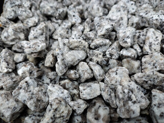 Small stones, rock material, various colors for use in the garden and construction.
