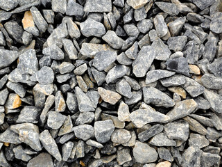 Small stones, rock material, various colors for use in the garden and construction.
