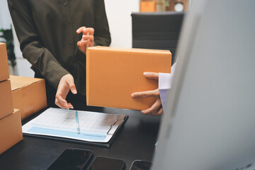 Portrait of Starting small businesses SME owners, two Asian woman check online orders Selling products working with boxs freelance work at home office, sme business online small medium enterprise