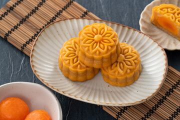 Cantonese moon cake for Mid-Autumn Festival food mooncake on blue table background.