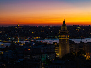 Naklejka premium Iconic Galata Tower in the Sunset Lights Drone Photo, Galata Beyoglu, Istanbul Turkiye (Turkey)
