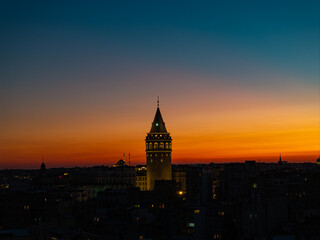 Obraz premium Iconic Galata Tower in the Sunset Lights Drone Photo, Galata Beyoglu, Istanbul Turkiye (Turkey)