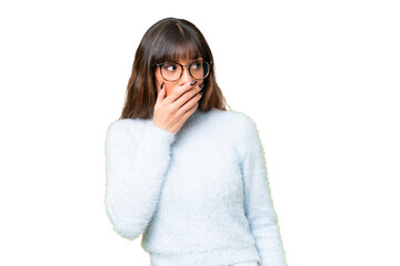 Young caucasian woman over isolated chroma key background doing surprise gesture while looking to...