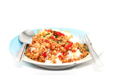 Rice with basil, minced pork, fried egg, delicious and spicy Thai food is popular all over the world, ready to be served to you on a white background.