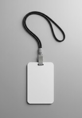 Fototapeta premium Blank mockup ID card badge with a black lanyard for a conference or corporate event branding